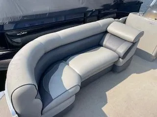 Slide: The Image of 2018 Premier 220 SunSation boat with gray and white cushioned seating. - 5