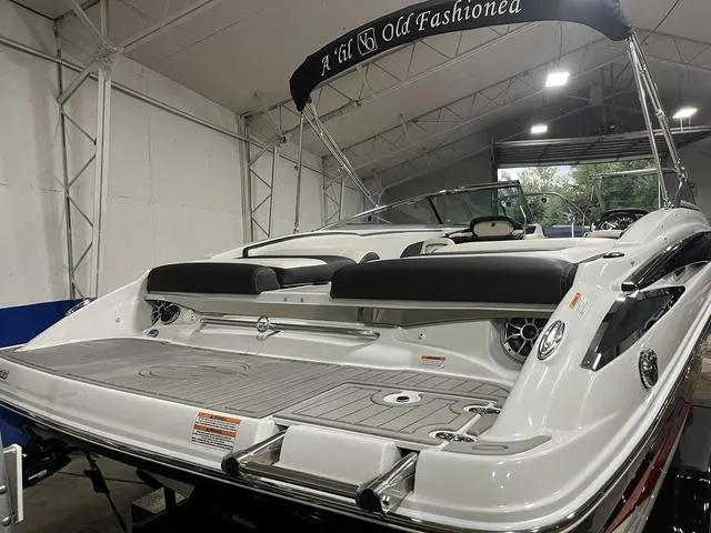 Slide: The Image of 2020 Crownline 235 SS boat in indoor storage, rear view. - 10
