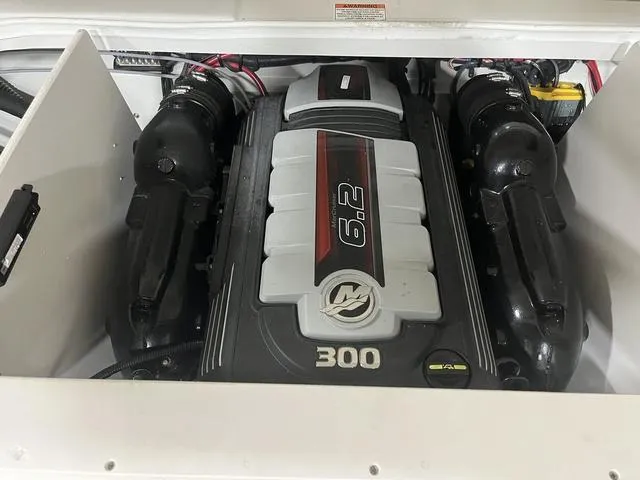 Slide: The Image of 2020 Crownline 235 SS boat engine compartment with 6.2L 300 HP engine. - 11