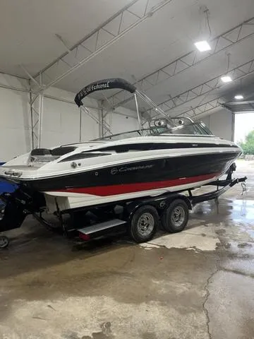 Slide: The Image of 2020 Crownline 235 SS boat on trailer in indoor storage. - 5