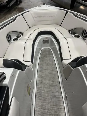 Slide: The Image of 2020 Crownline 235 SS boat interior with white seating and gray flooring. - 6