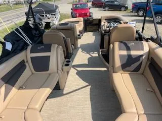 Slide: The Image of 2023 Barletta Cabrio 22QC pontoon boat interior with tan and black seating. - 7