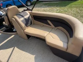 Slide: The Image of 2023 Barletta Cabrio 22QC boat interior with tan and black seating. - 8