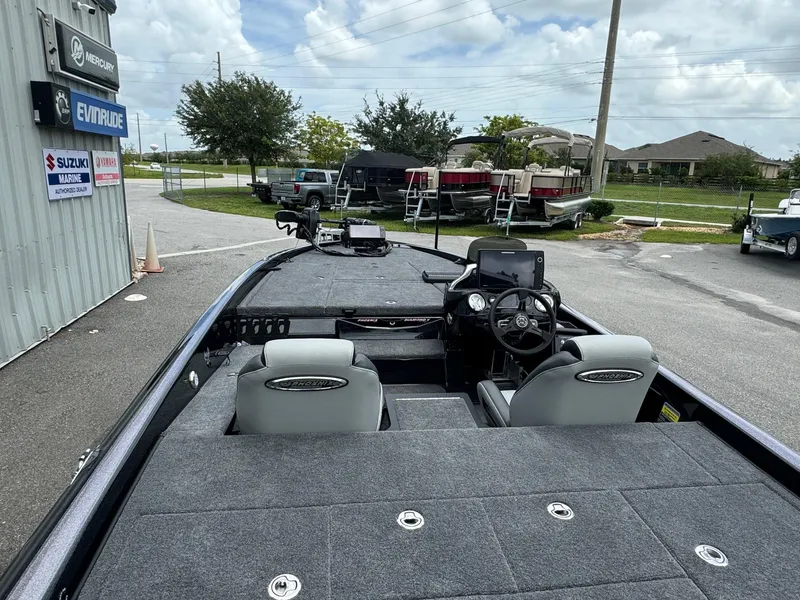 Slide: The Image of Phoenix 920 Elite 2 boat, 2025 model, interior view at dealership. - 13