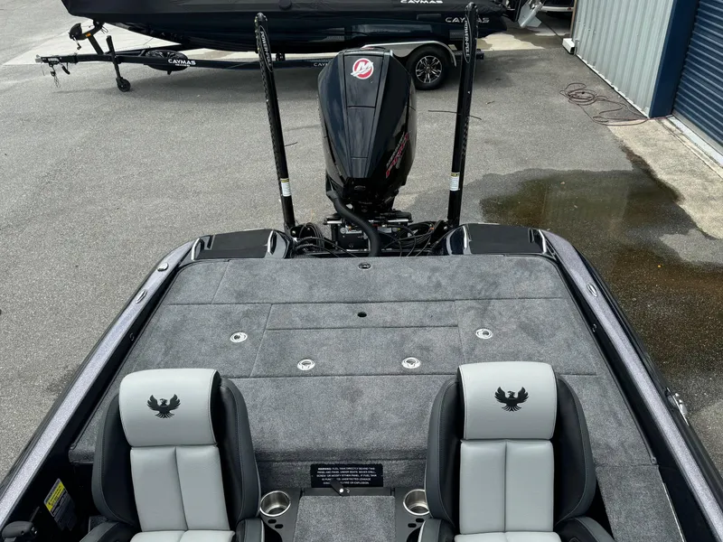 Slide: The Image of 2025 Phoenix 920 Elite 2 boat with dual seats and powerful outboard motor. - 14