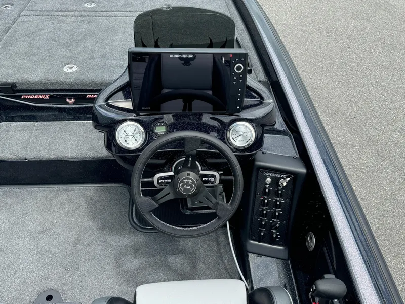 Slide: The Image of 2025 Phoenix 920 Elite 2 boat dashboard with advanced navigation system and controls. - 16