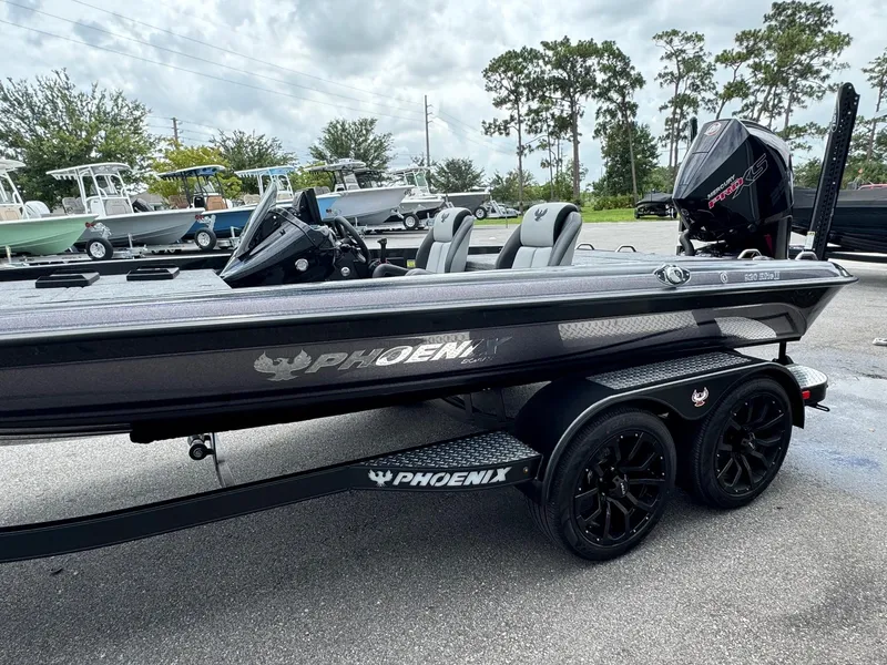 Slide: The Image of 2025 Phoenix 920 Elite 2 fishing boat on trailer in parking lot. - 4