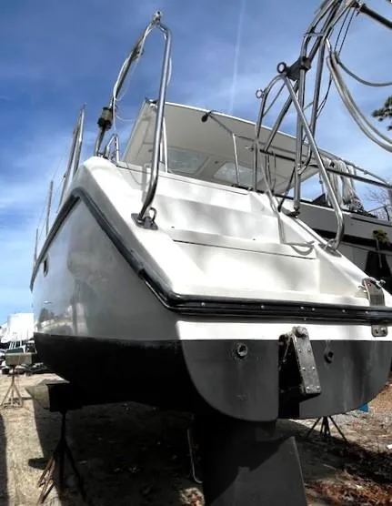 Slide: The Image of 2010 Gemini 105Mc catamaran on dry dock, viewed from the stern under a clear blue sky. - 13