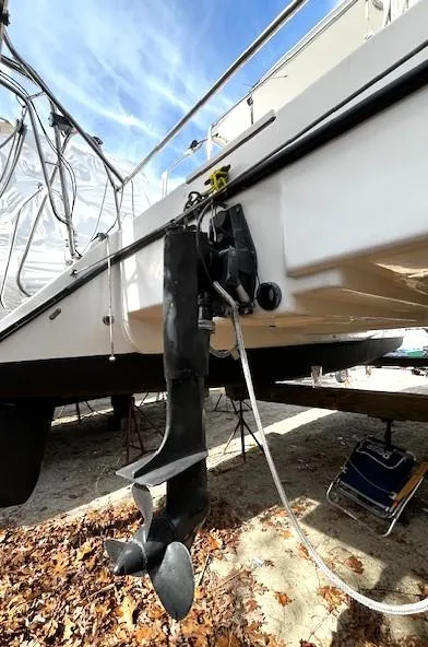 Slide: The Image of 2010 Gemini 105Mc sailboat with outboard motor, displayed on dry land. - 14