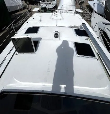 Slide: The Image of 2010 Gemini 105Mc sailboat deck with open hatch and shadow. - 30