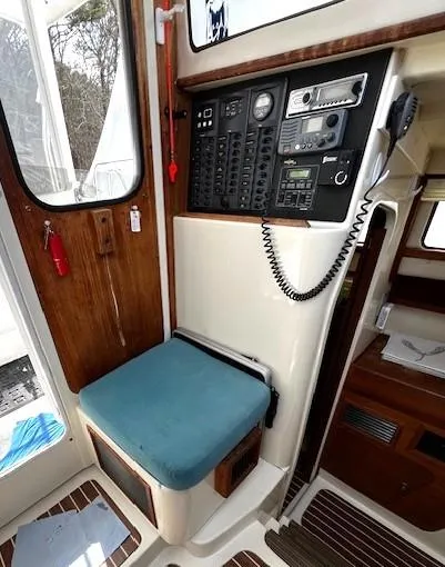 Slide: The Image of Interior of 2010 Gemini 105Mc sailboat with control panel and seating area. - 35