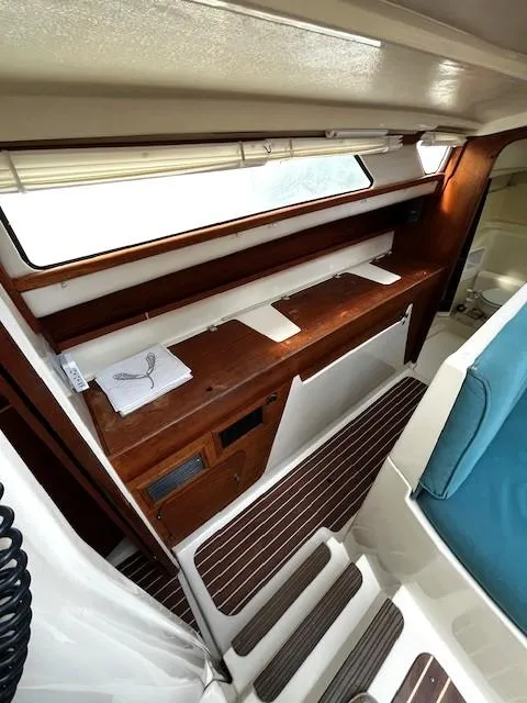 Slide: The Image of Interior of 2010 Gemini 105Mc sailboat with wooden cabinetry and seating. - 42