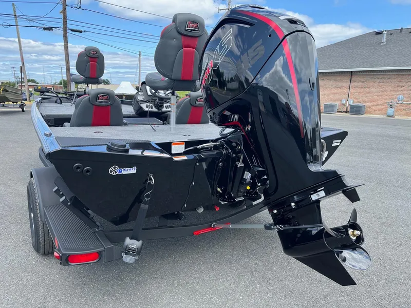 Slide: The Image of 2024 Ranger RT188 boat with powerful outboard motor, parked outdoors. - 4