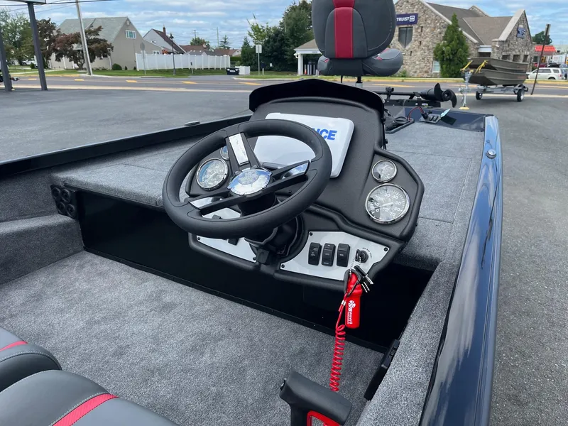 Slide: The Image of 2024 Ranger RT188 boat dashboard with steering wheel and control panel. - 6