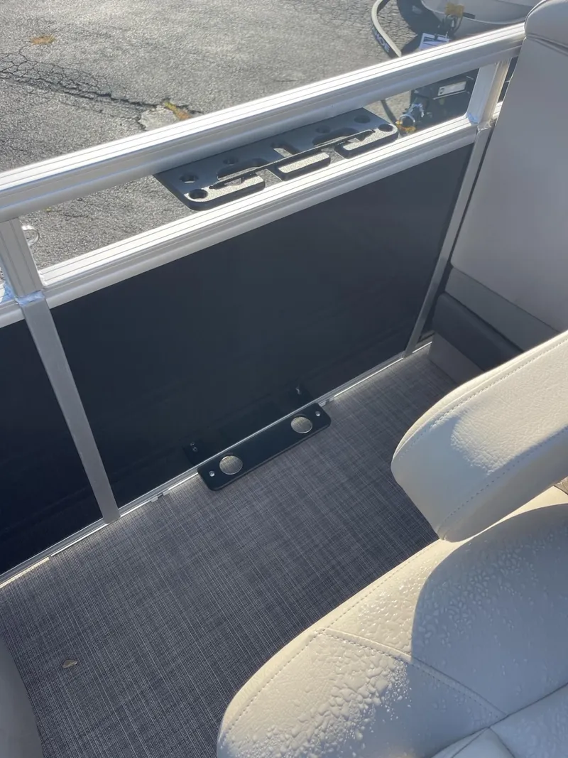 Slide: The Image of 2024 Sun Tracker Sportfish 24 XP3 interior with seating and railing detail. - 16