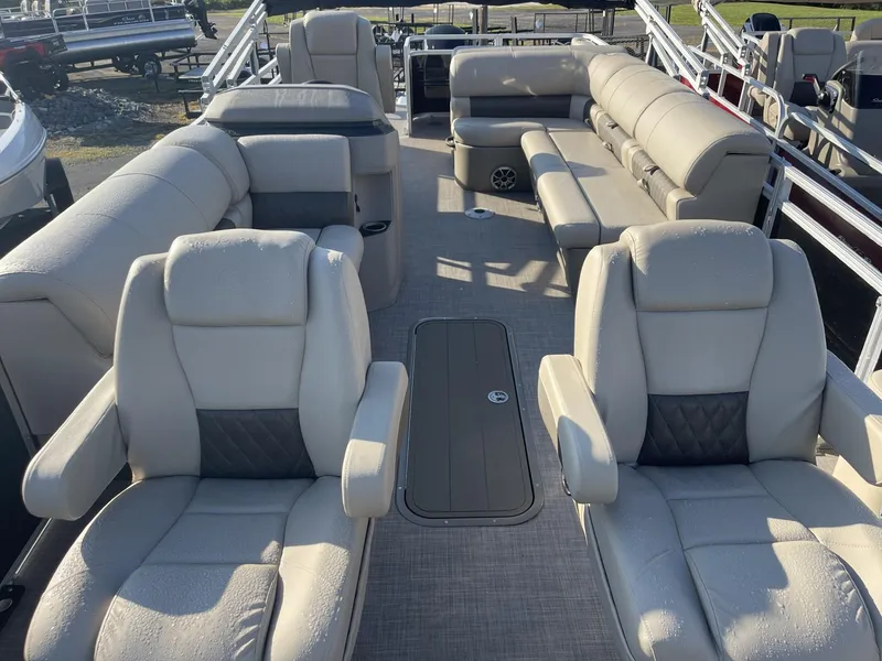 Slide: The Image of 2024 Sun Tracker Sportfish 24 XP3 pontoon boat interior with plush seating. - 5