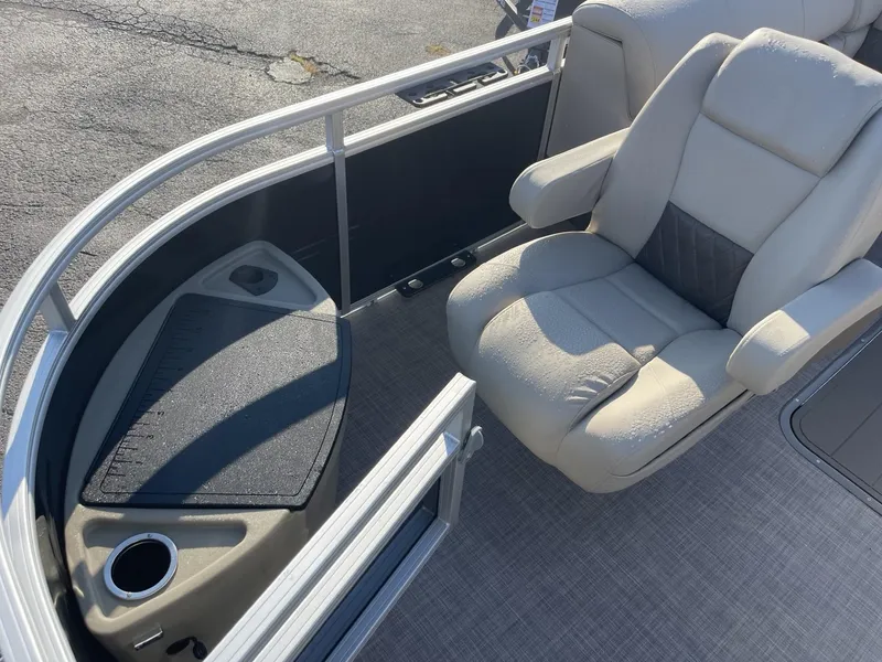 Slide: The Image of 2024 Sun Tracker Sportfish 24 XP3 boat interior with comfortable seating and cup holder. - 7