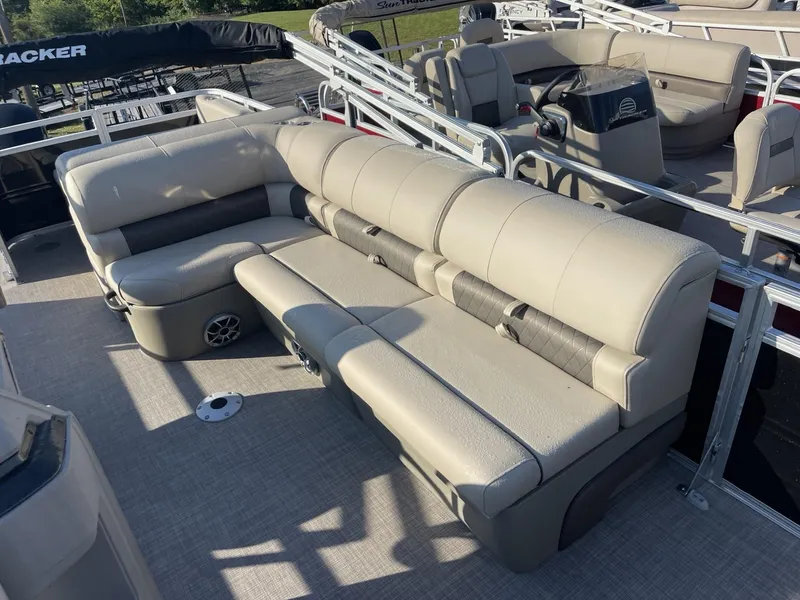 Slide: The Image of 2024 Sun Tracker Sportfish 24 XP3 pontoon boat with beige seating. - 9