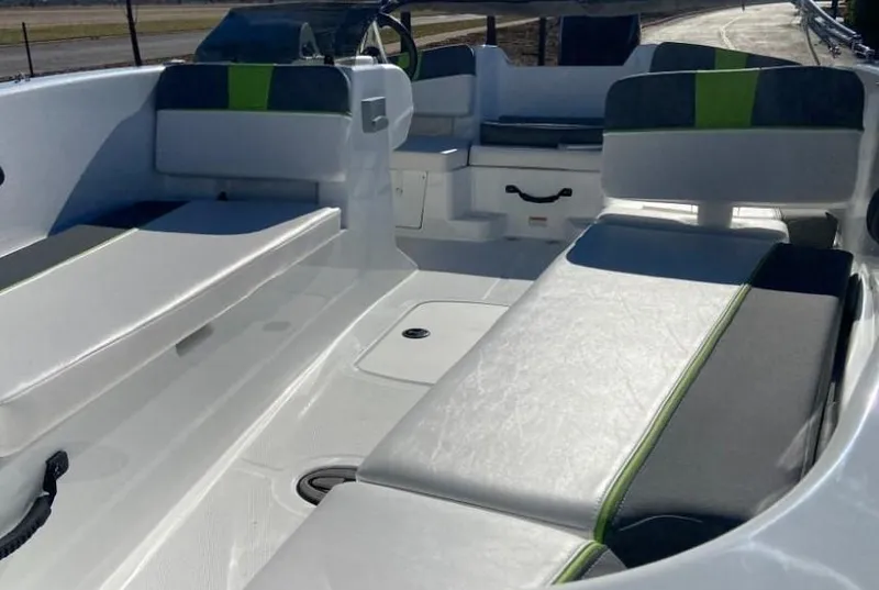 Slide: The Image of 2024 Tahoe T18 boat interior with white and green seating. - 3