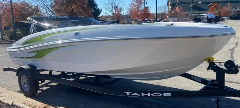 Slide: The Image of 2024 Tahoe T18 boat on a trailer in a parking lot. - 4