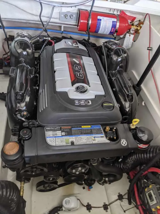 Slide: The Image of 2021 Sea Ray SLX 230 engine compartment with MerCruiser 6.2L 350 HP engine. - 6