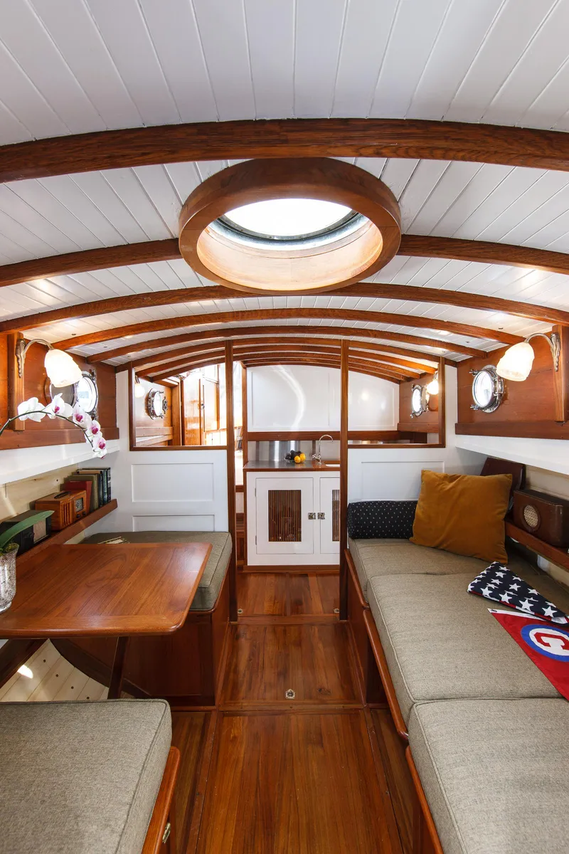 Slide: The Image of 1929 Stephens Brothers 34 Trunk Cabin Cruiser interior with wood finish and cozy seating. - 10