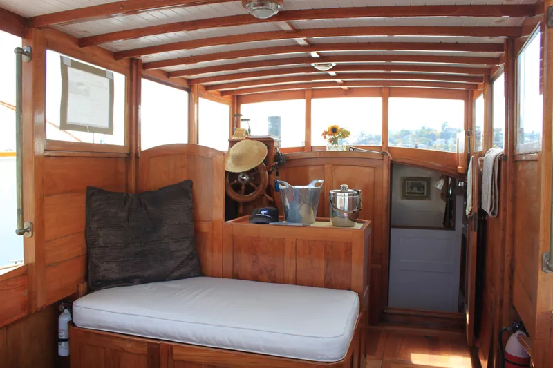 Slide: The Image of Interior of 1929 Stephens Brothers 34 Trunk Cabin Cruiser with wooden finish and seating area. - 13