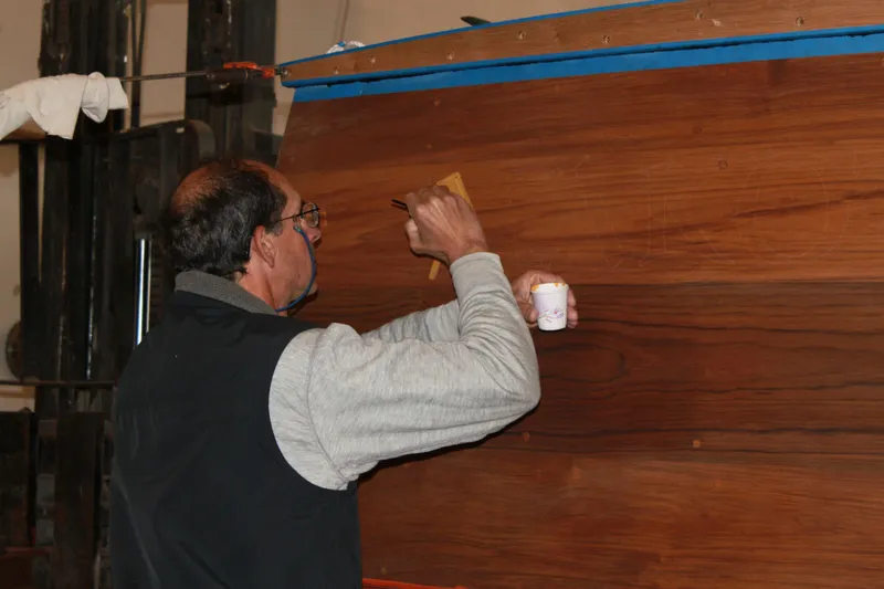 Slide: The Image of Man restoring 1929 Stephens Brothers 34 Trunk Cabin Cruiser's wooden exterior. - 15