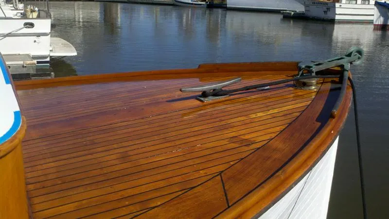 Slide: The Image of 1929 Stephens Brothers 34 Trunk Cabin Cruiser with polished wooden deck at marina. - 22