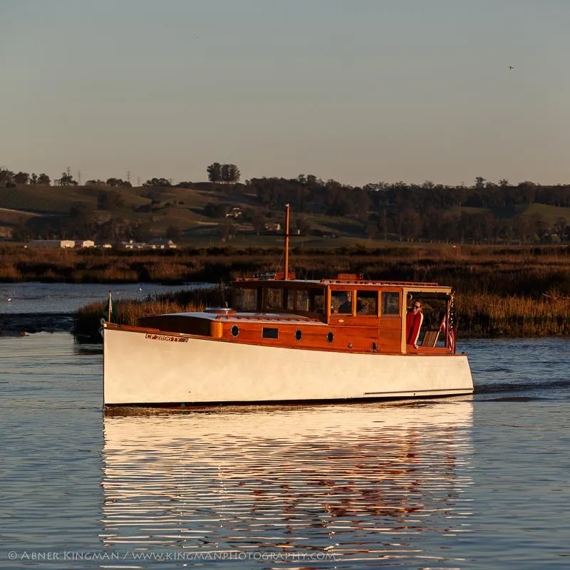 Slide: The Image of 1929 Stephens Brothers 34 Trunk Cabin Cruiser on serene water at sunset. - 24
