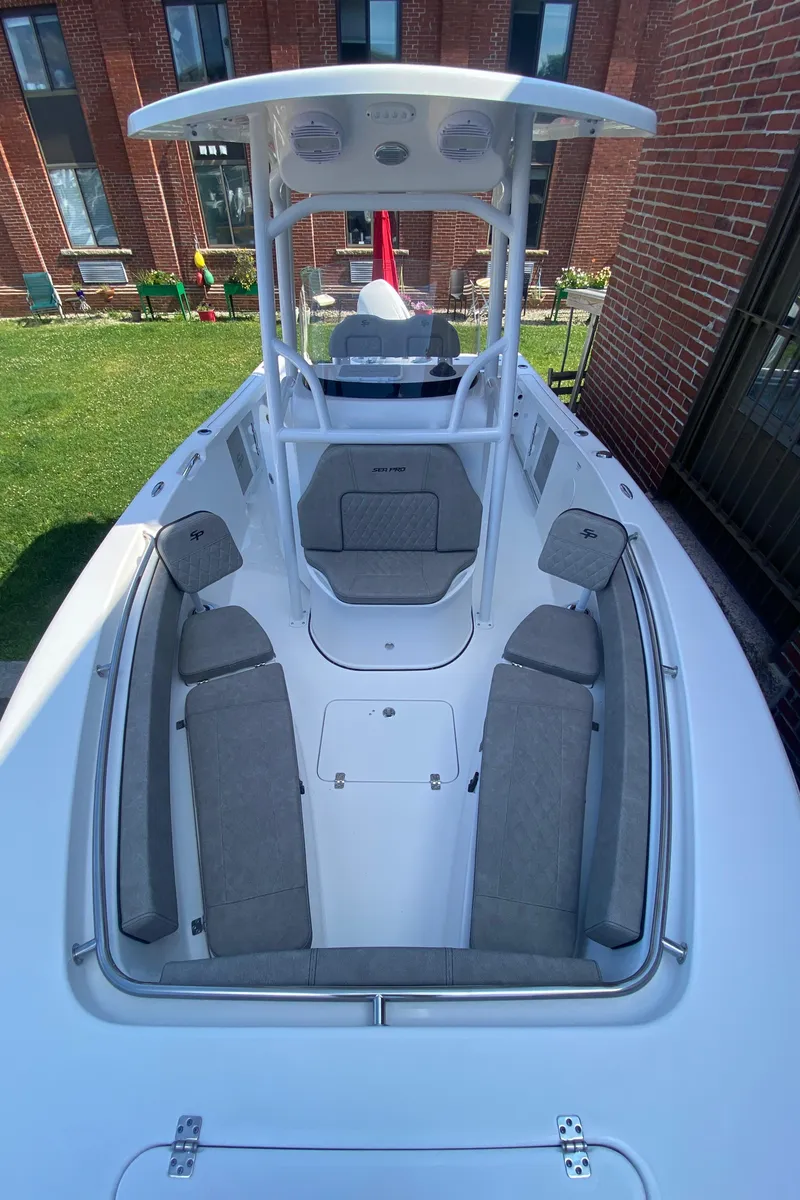 Slide: The Image of 2024 Sea Pro 222 Center Console boat with spacious seating and modern design. - 11