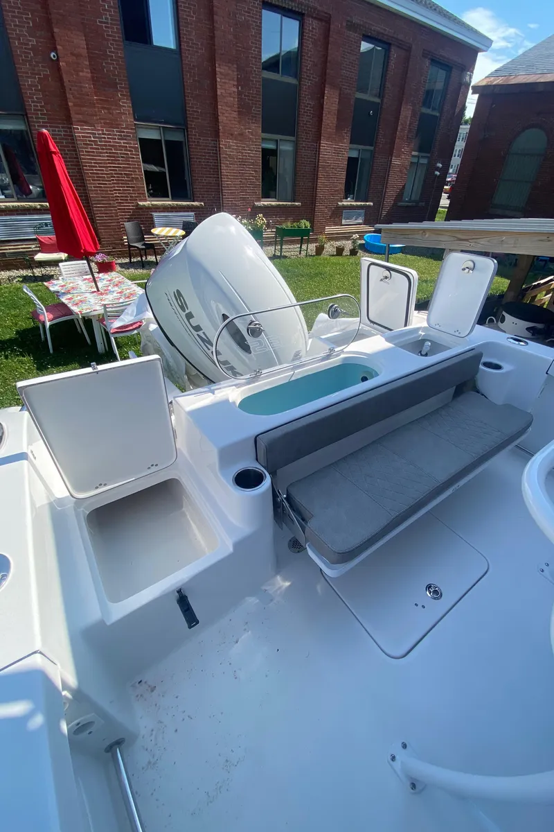 Slide: The Image of 2024 Sea Pro 222 Center Console boat with seating and storage compartments. - 5