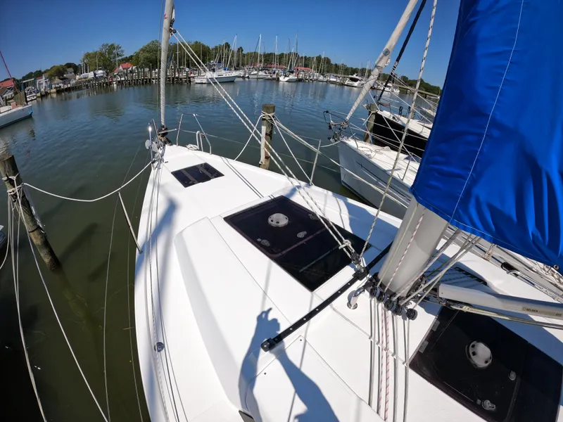 Slide: The Image of Hanse 388 sailboat from 2019 docked in a marina under clear blue skies. - 14
