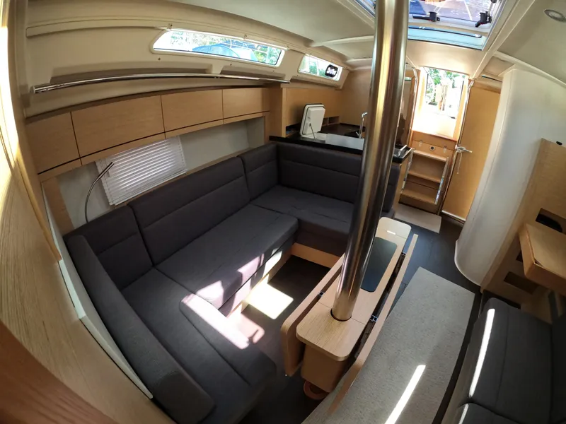 Slide: The Image of Interior of 2019 Hanse 388 yacht with modern seating and natural light. - 19