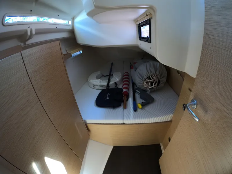 Slide: The Image of Cozy cabin interior of 2019 Hanse 388 sailboat with storage and equipment. - 24