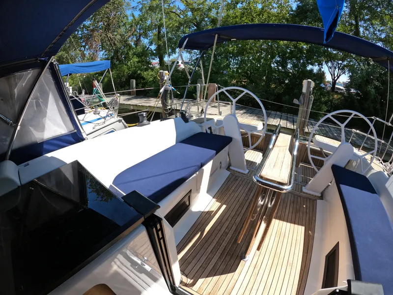 Slide: The Image of Spacious 2019 Hanse 388 yacht cockpit with dual steering wheels and comfortable seating. - 27