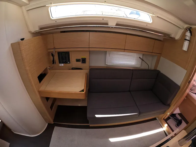 Slide: The Image of Interior of 2019 Hanse 388 yacht with modern seating and navigation station. - 29