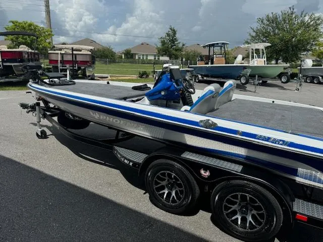 Slide: The Image of 2025 Phoenix 920 Elite 2 boat on trailer in parking lot. - 1
