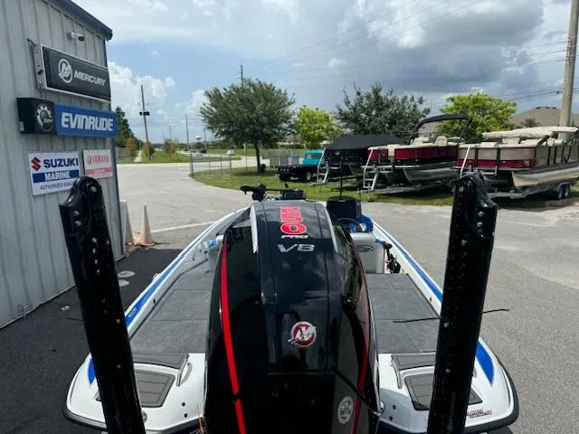 Slide: The Image of Phoenix 920 Elite 2 boat, 2025 model, with Mercury V8 engine at a marina. - 10