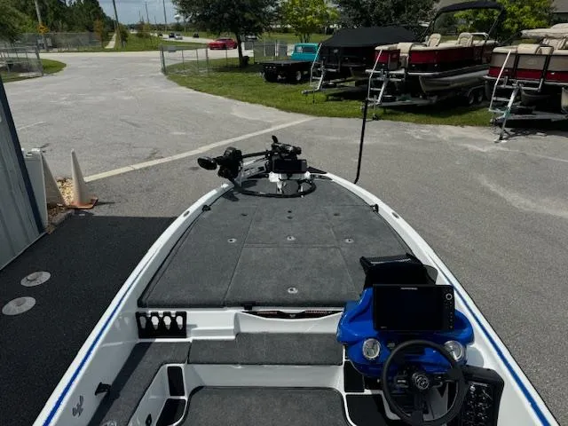 Slide: The Image of 2025 Phoenix 920 Elite 2 fishing boat with advanced navigation system and spacious deck. - 5