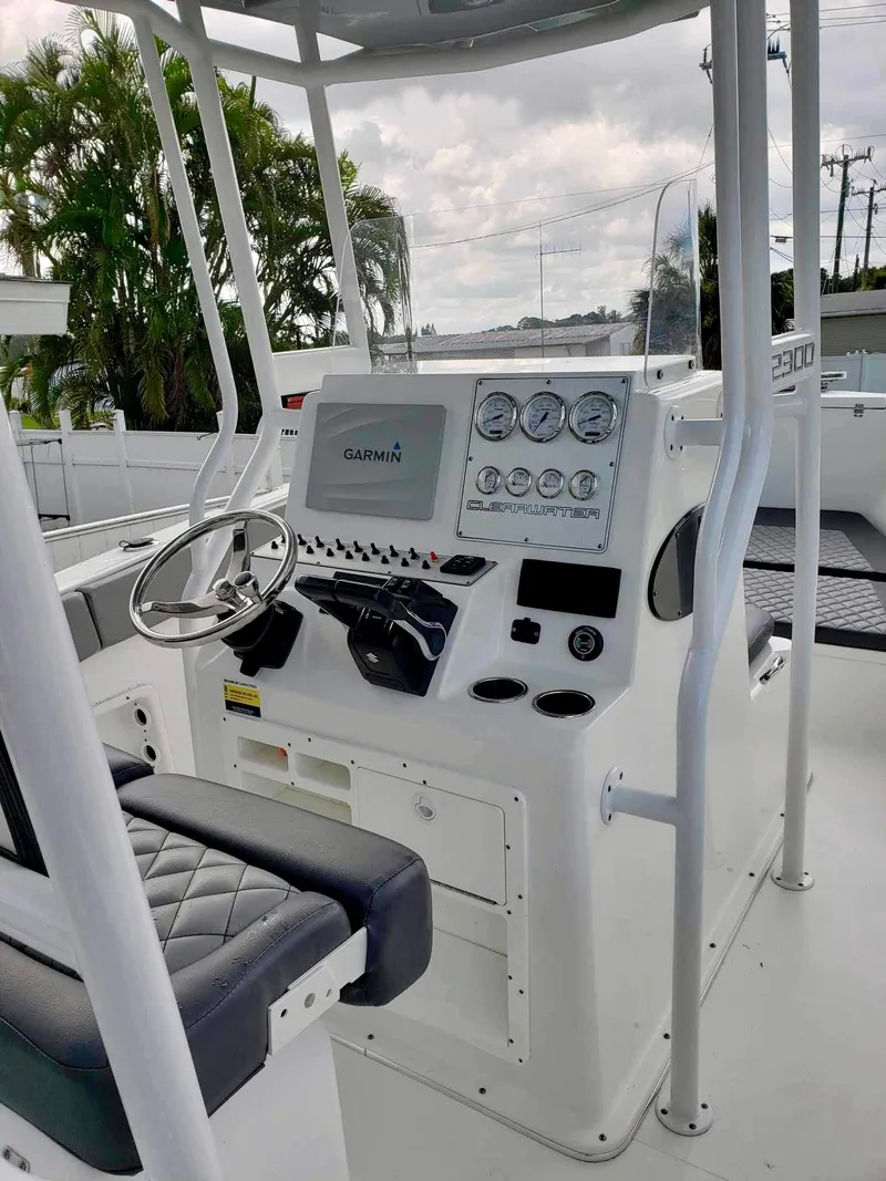 Slide: The Image of 2022 Clearwater 2300 boat console with Garmin navigation and modern controls. - 15