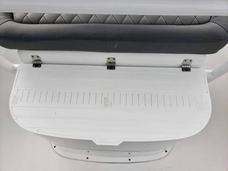 Slide: The Image of 2022 Clearwater 2300 boat seat with white foldable deck and gray cushioned backrest. - 16