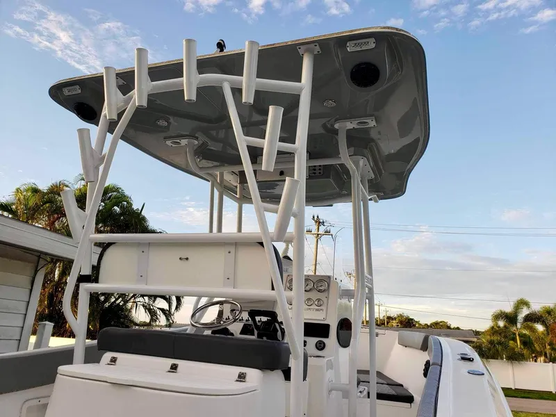 Slide: The Image of Clearwater 2300 boat, 2022 model, featuring a sleek T-top and modern console design. - 9