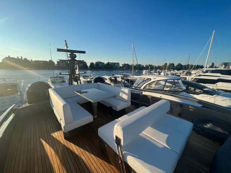 Slide: The Image of Luxurious 2017 Pershing 92 Motor Yacht with spacious deck and elegant seating at marina. - 23