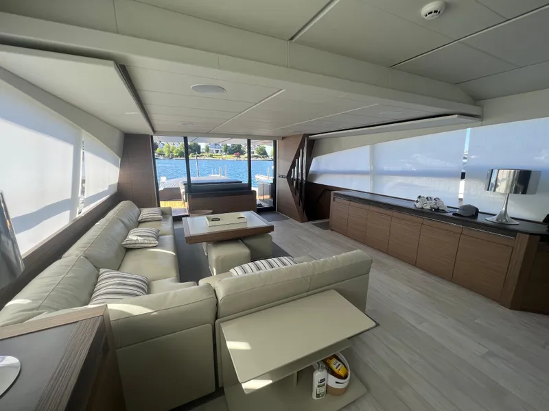Slide: The Image of Luxurious interior of 2017 Pershing 92 Motor Yacht with modern furnishings and scenic ocean view. - 31