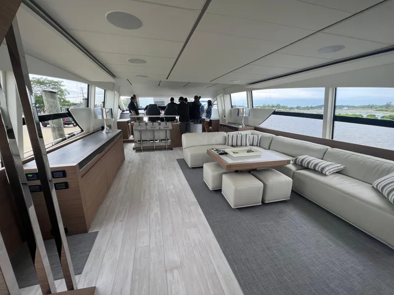 Slide: The Image of Luxurious interior of 2017 Pershing 92 Motor Yacht with modern furnishings and panoramic windows. - 33