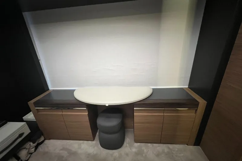 Slide: The Image of Modern interior of 2017 Pershing 92 Motor Yacht with sleek desk and stool. - 38