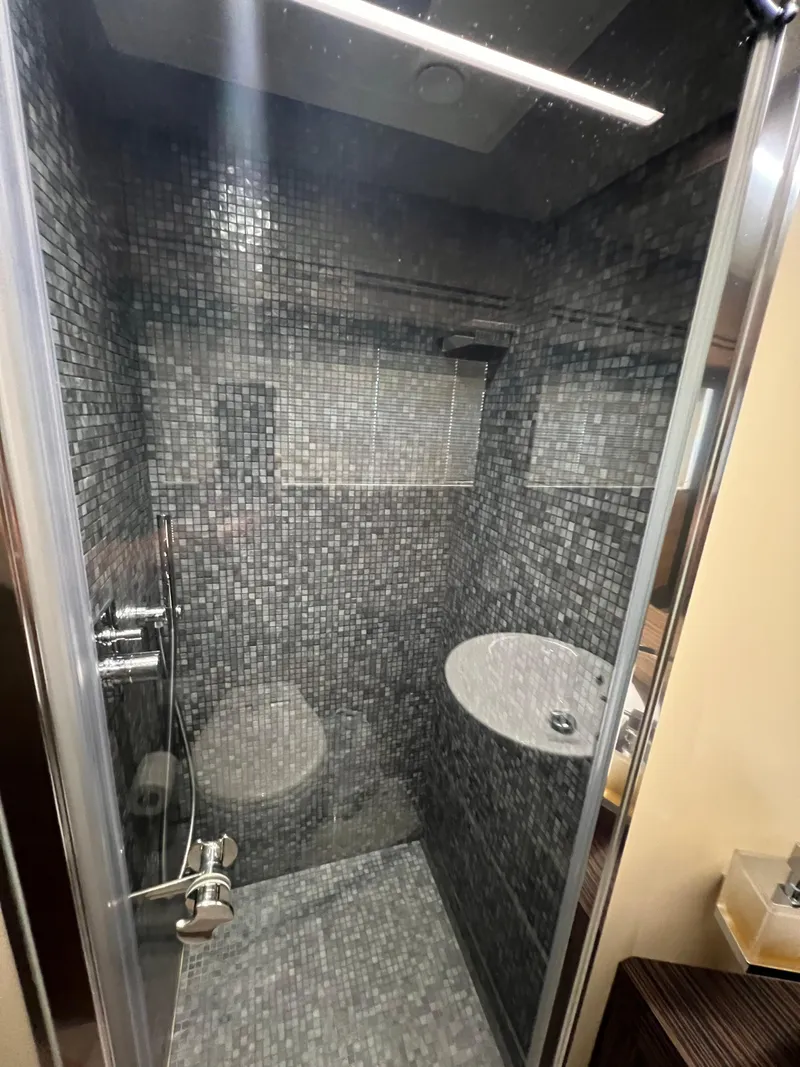 Slide: The Image of Luxurious bathroom in 2017 Pershing 92 Motor Yacht with modern mosaic tile design. - 42