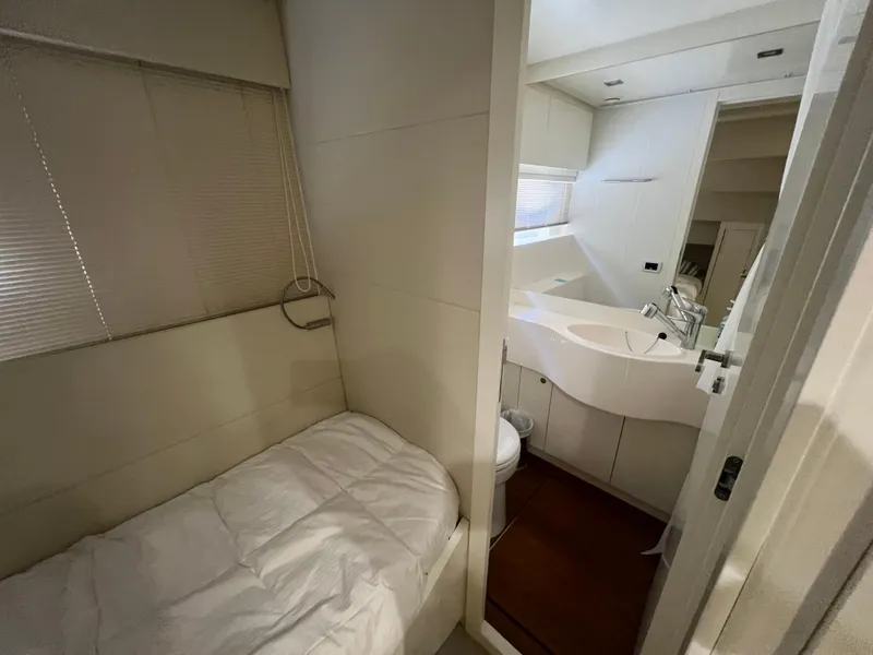 Slide: The Image of Compact bedroom and bathroom interior of 2017 Pershing 92 Motor Yacht. - 46