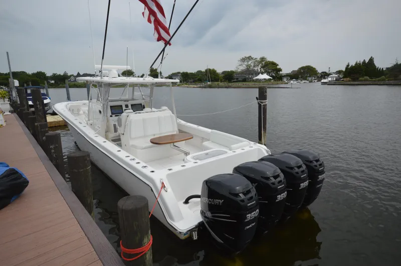 The Image of 2018 Invincible 43 Open Fisherman boat docked with four Mercury 350 engines. - 0